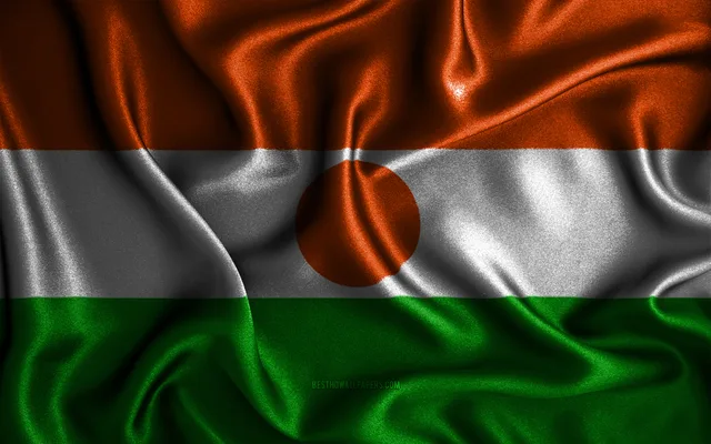 Le drapeau du Niger, bandes orange, blanche et verte avec un disque orange au centre, image d'illustration d'archives